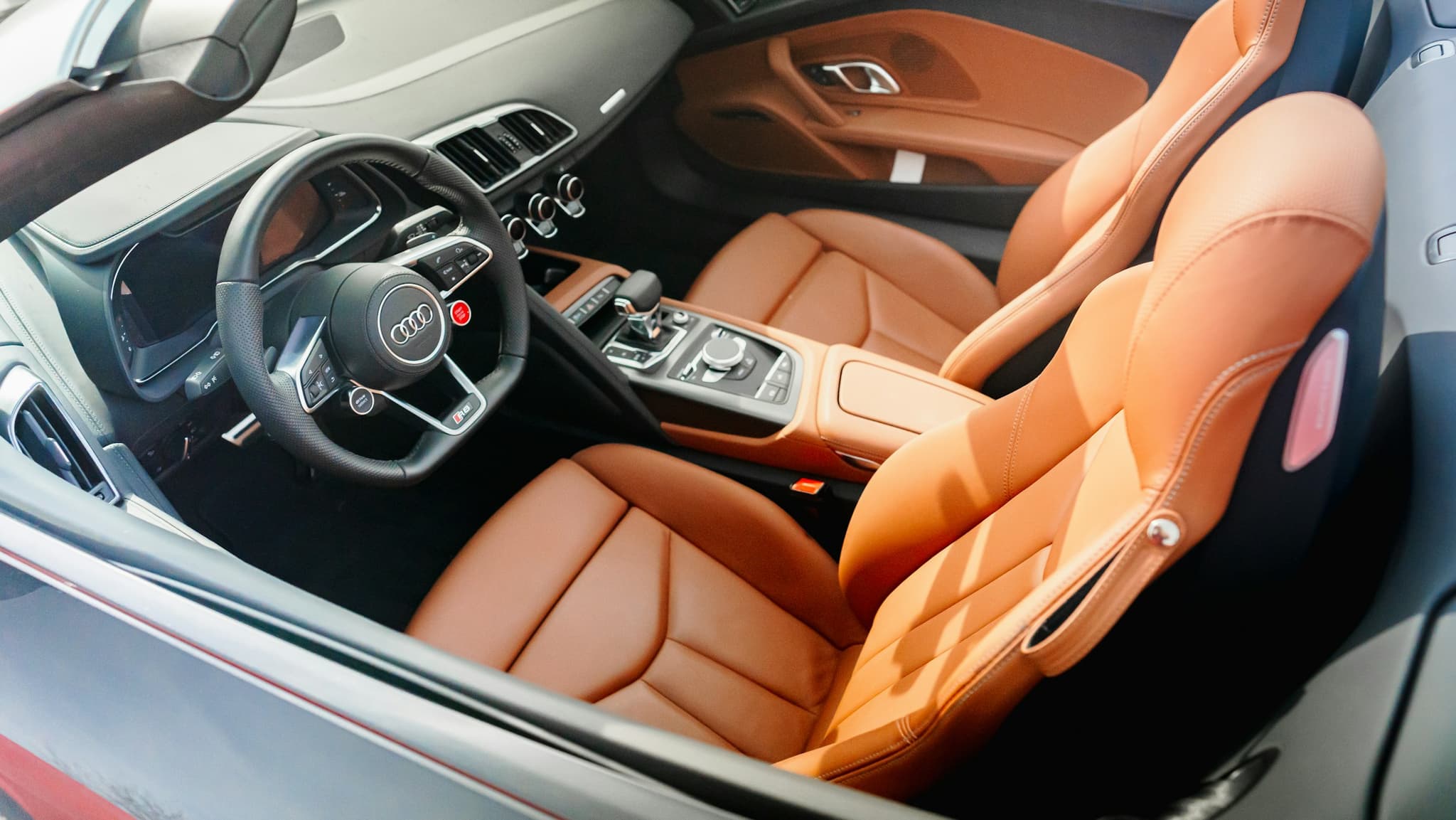 A spotless vehicle cabin with contrasting leather seats
